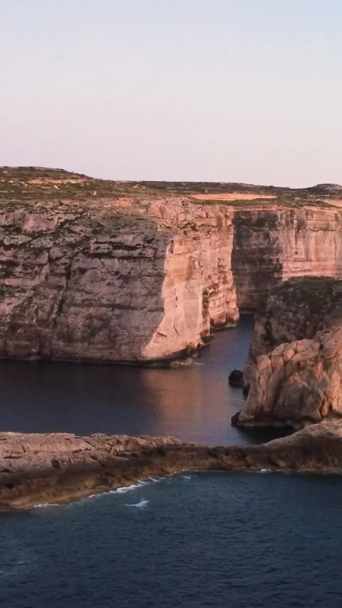 Sunset Over the Cliffs and Ocean in Malta With Clear Skies and Sea Waves. Gozo, Stock Footage 334856417