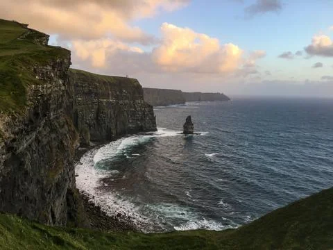 Sunset Over Cliffs of Moher with Calm Ocean Stock Photos