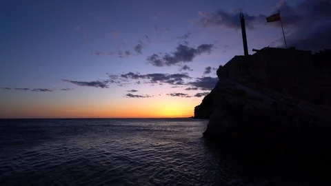 Sunset over cliffs in Petrovac panorama Stock Footage 94782174