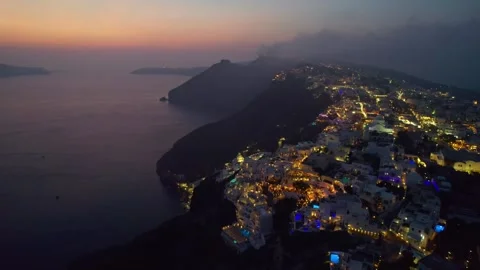 Sunset over cliffside ocean buildings 4K Stock Footage 314753949