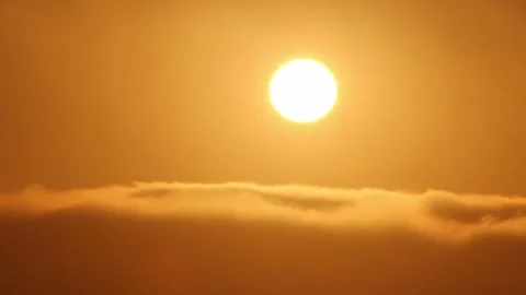 Sunset over the clouds Stock Footage 166805459