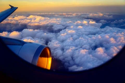 Sunset over clouds Stock Photos