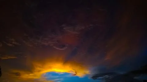 Sunset over clouds Stock Photos