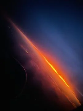 Sunset over clouds Stock Photos