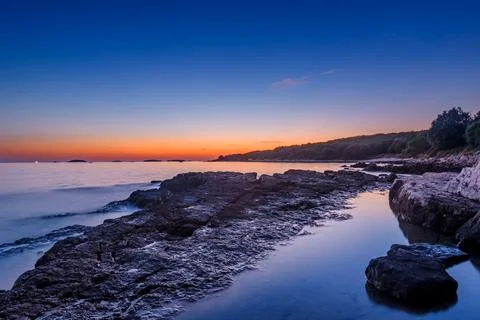 Sunset Over Coastline Stock Photos