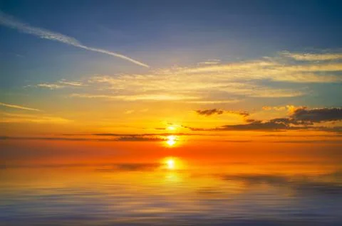 Sunset over cold ocean.5 Stock Photos