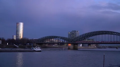 Sunset over the Cologne Skyline Triangle Tower Crowd Pass Bridge Tourists Travel Stock Footage 87825576