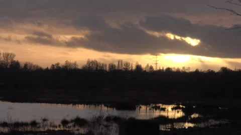 Sunset over countryside and reflecting lake in England UK 4K Stock Footage 147991034