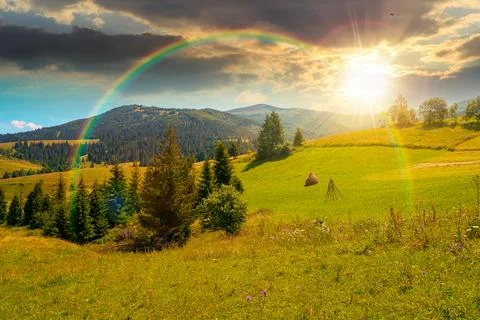 Sunset over countryside mountain landscape in summer Stock Photos