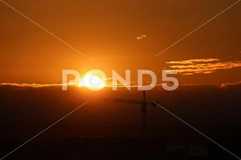 Sunset over crane Stock Photos