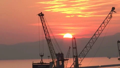 Sunset over cranes Stock Footage 75435351