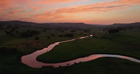 Sunset over a curvy river Stock Footage 285405596