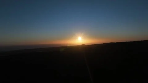 Sunset Over Dark Landscape with Deep Blue Sky – Gran Canaria Aerial Stock Footage 309943657