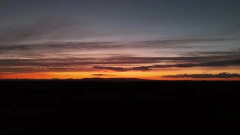 Sunset Over Dark Rural Landscape With Cloudy Sky Vidéo 333412256