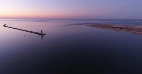 Sunset over the Delaware bay with a lighthouse, aerial drone shot Stock Footage 143207053