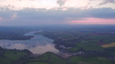 Sunset over Devon Fields and Farmlands and River Dart from a drone 動画素材 187545439