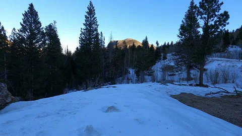 Sunset over distant peaks in Snowy Rocky Mountains Stock-Footage 170591169