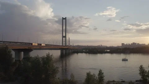 Sunset over the Dnieper river. South bridge. Peak hour. Aerial. Kyiv. Stock Footage 232003993