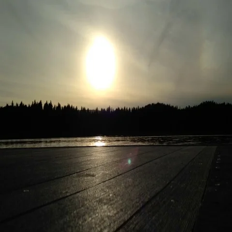 Sunset Over Dock on Lake in Forest Background Stock Footage 69692585