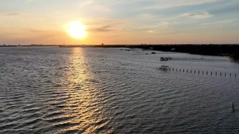 Sunset over docks and water Panama City Beach Florida captured in 5k Stock Footage 240973150