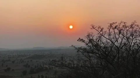 Sunset Over Dry Landscape with Tree Silhouette Stock Footage 327982246