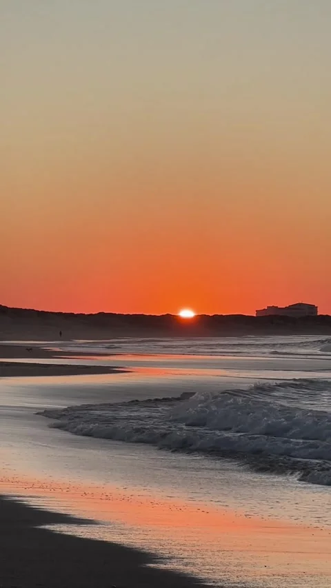 Sunset over dunes and ocean Portugal coast Stock Footage 331659732