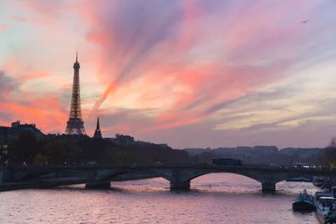 Sunset over Eiffel Tower and Seine river. Stock Photos