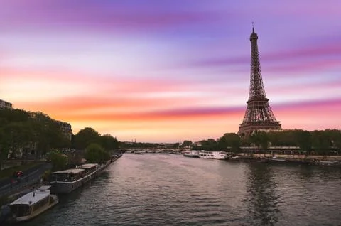 Sunset over the the Eiffel Tower and the Seine River in Paris, France. Stock Photos