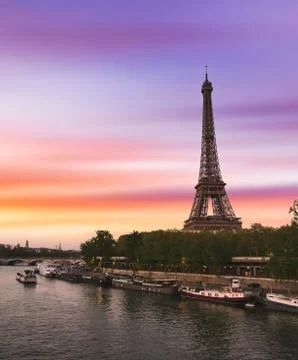 Sunset over the the Eiffel Tower and the Seine River in Paris, France. Stock Photos