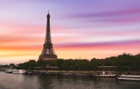 Sunset over the the Eiffel Tower and the Seine River in Paris, France. Stock Photos