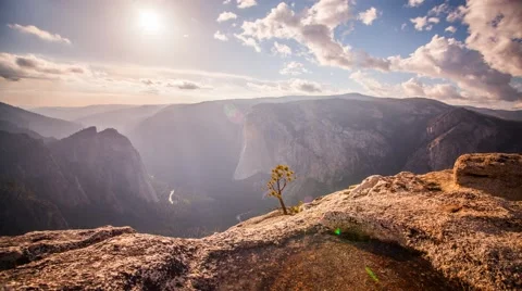 Sunset over epic Yosemite Valley with Sunbeams moving through the clouds Video stock 60689461