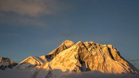 Sunset over Everest from the summit of Mt Lobuche with dramatic clouds Stock-Footage 122115761