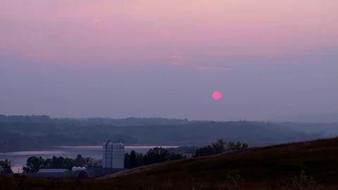 Sunset over a farm and river. Stock Footage 82794786
