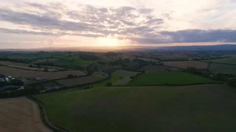 Sunset over Farmlands and Fields from a drone, Devon, England, Europe Stock Footage 209191682