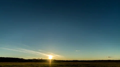 Sunset over the field with a barn. Stars appear. Time Lapse. 4K Stock Footage