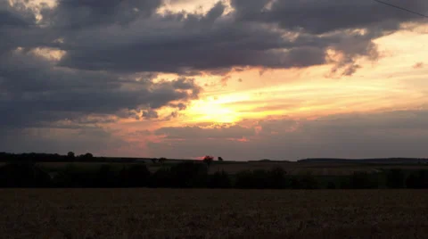 Sunset Over Field With Clouds Stock Footage 29645628