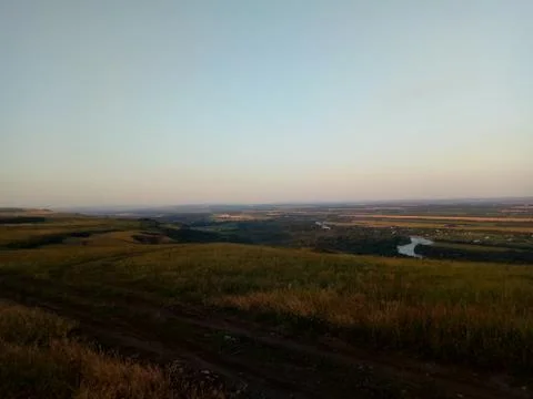 Sunset over the field in summer Stock Photos
