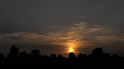Sunset over the field timelapse Stock Footage 219748257