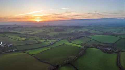 Sunset over Fields and Farms in HYPERLAPSE from a drone, Devon, UK 動画素材 221156520