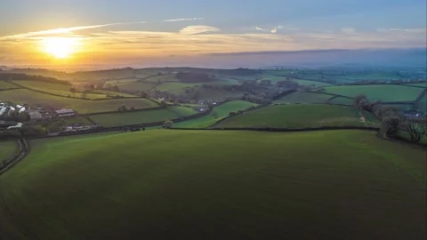 Sunset over Fields and Farms in HYPERLAPSE from a drone, Devon, UK 動画素材 221156606