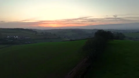 Sunset over Fields and Farms from a drone, Torquay, Devon, UK 库存影片 221176781