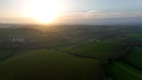 Sunset over Fields and Farms from a drone, Torquay, Devon, UK 動画素材 221176883