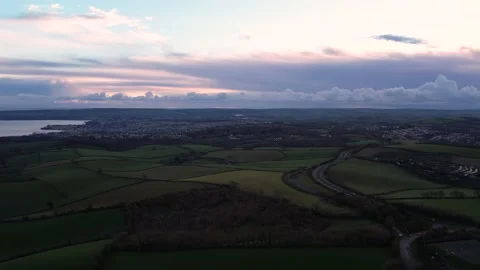 Sunset over Fields and Farms of Torquay and Paignton from a drone, Devon, UK 動画素材 225878328