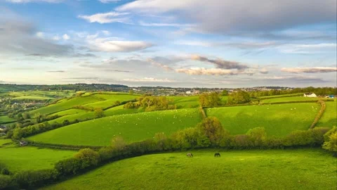 Sunset over Fields and Farms in Hyperlapse, Devon, England 動画素材 240668140