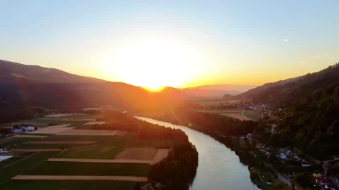 Sunset over fields and a river Stock Footage 312412620