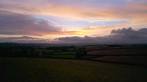 Sunset over the fields from a drone, Berry Pomeroy Village in Devon Stock-Footage 161792691