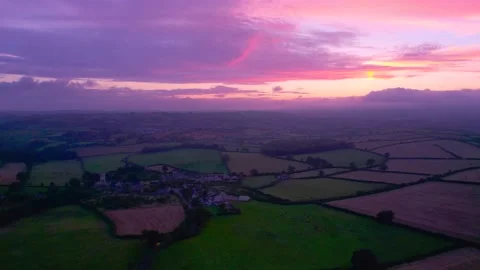 Sunset over the fields from a drone, Berry Pomeroy Village in Devon, England Video stock 162047809
