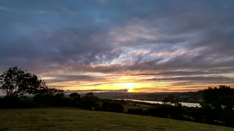 Sunset over the fields in Time Lapse Movie. Stock Footage 138506473