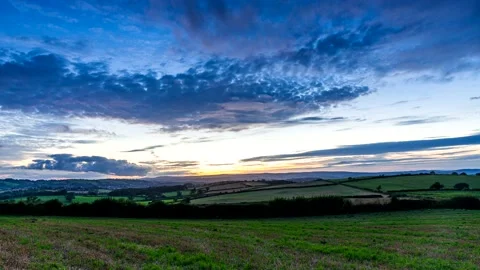 Sunset over the fields in Time Lapse Movie, Berry Pomeroy Village in Devon Stock-Footage 160875379
