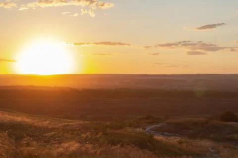 Sunset over the fields, view from the mountain Stock Photos